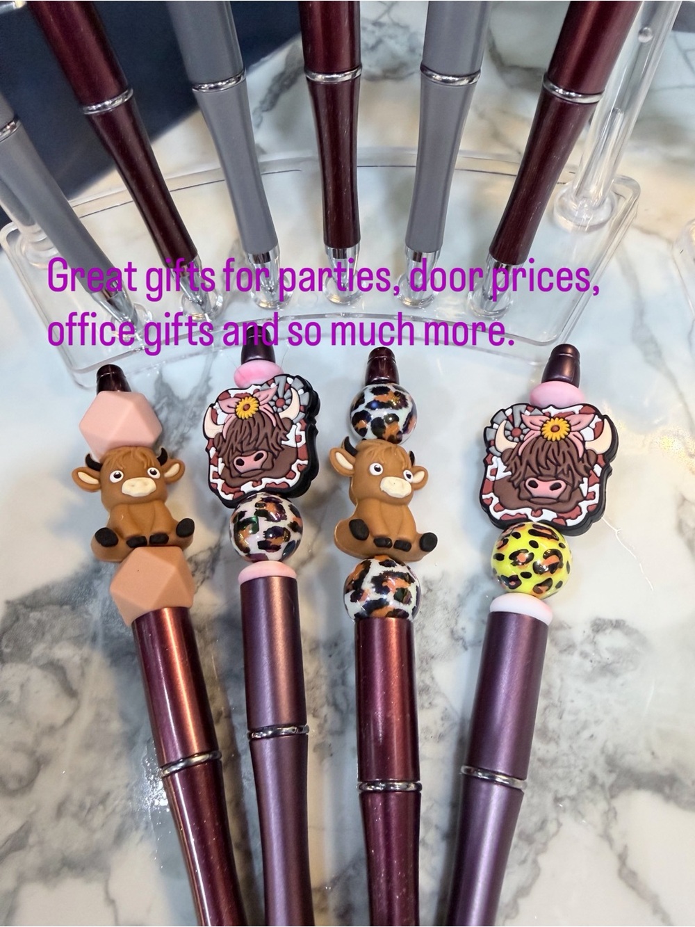 Highland Cow beaded pens with pinks, and browns.